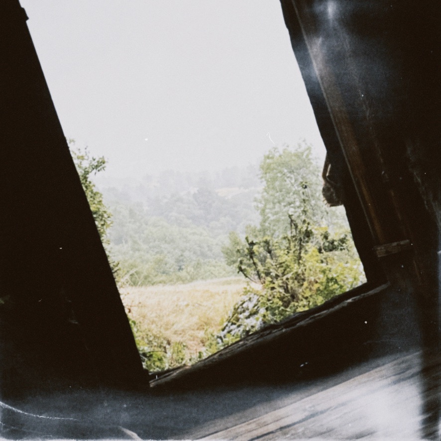 door with land and field